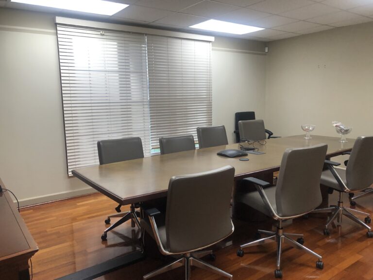 Conference room with meeting table and windows at Nuvork in Rocky Hill, CT